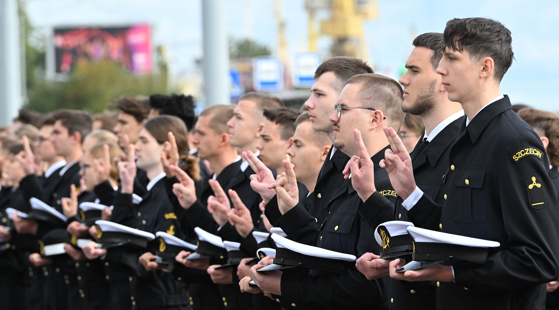 MUS students in uniforms taking the oath