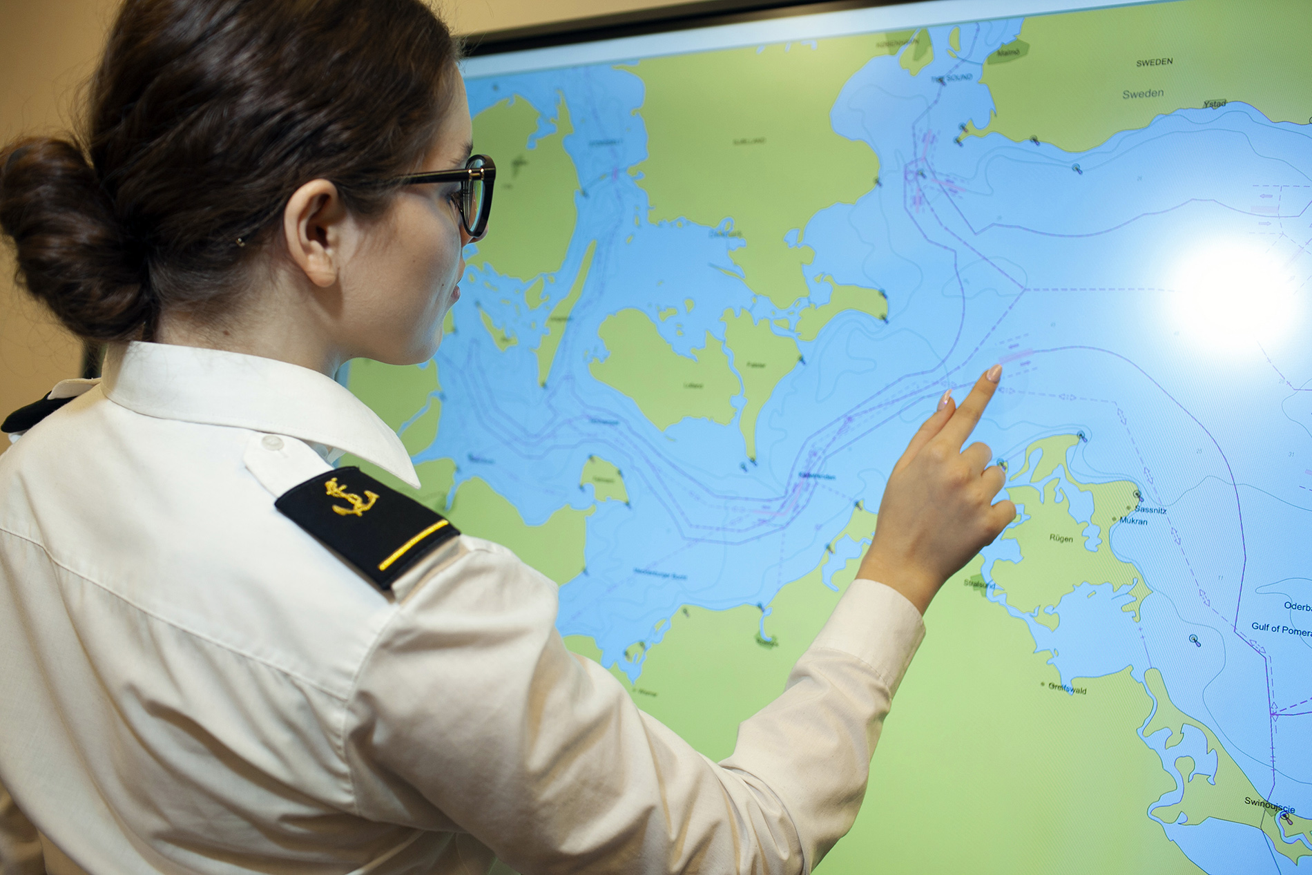 Navigation female student by the digital map table